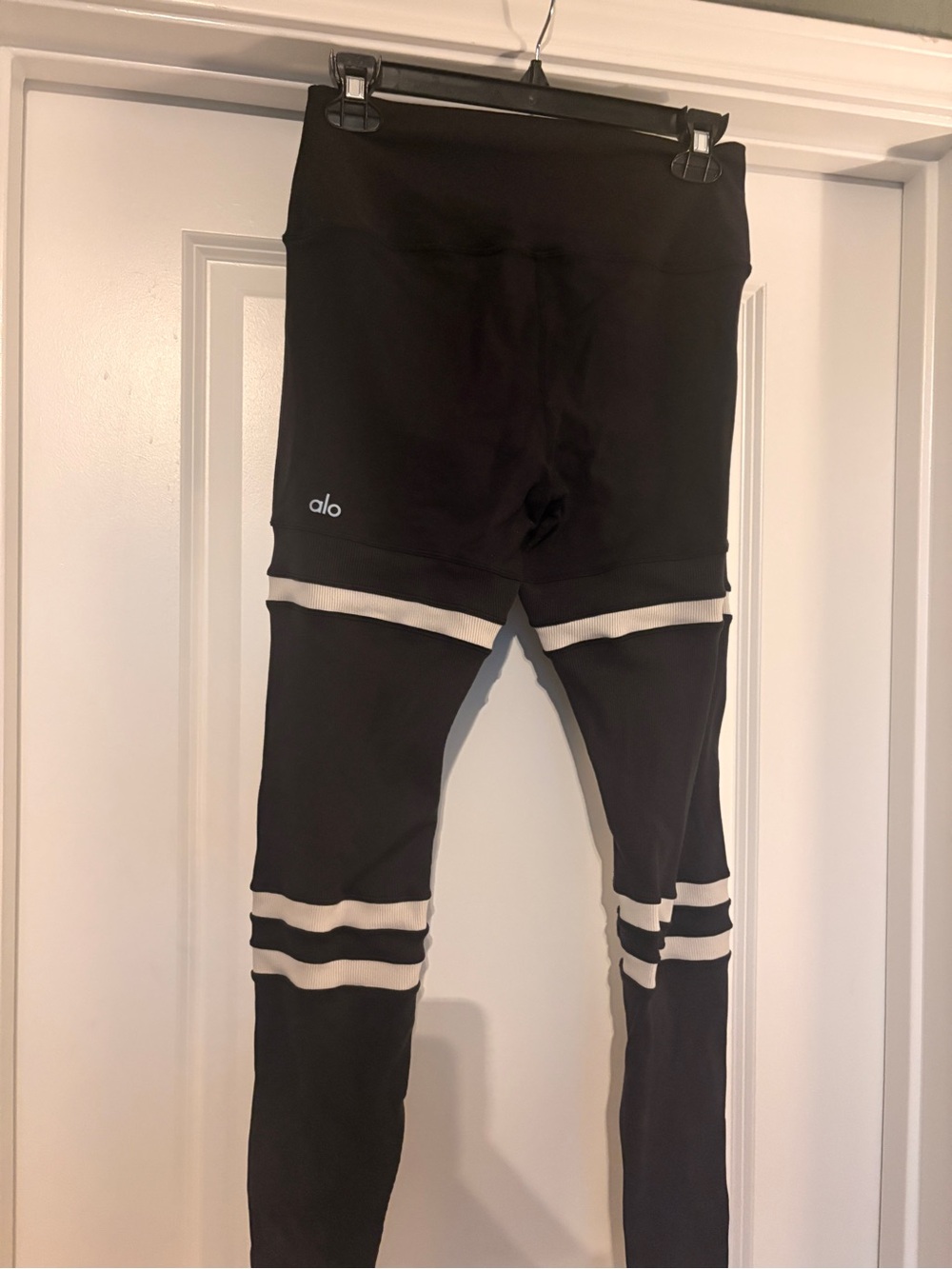 Alo yoga high waist Black Leggings with White Stripe accents.